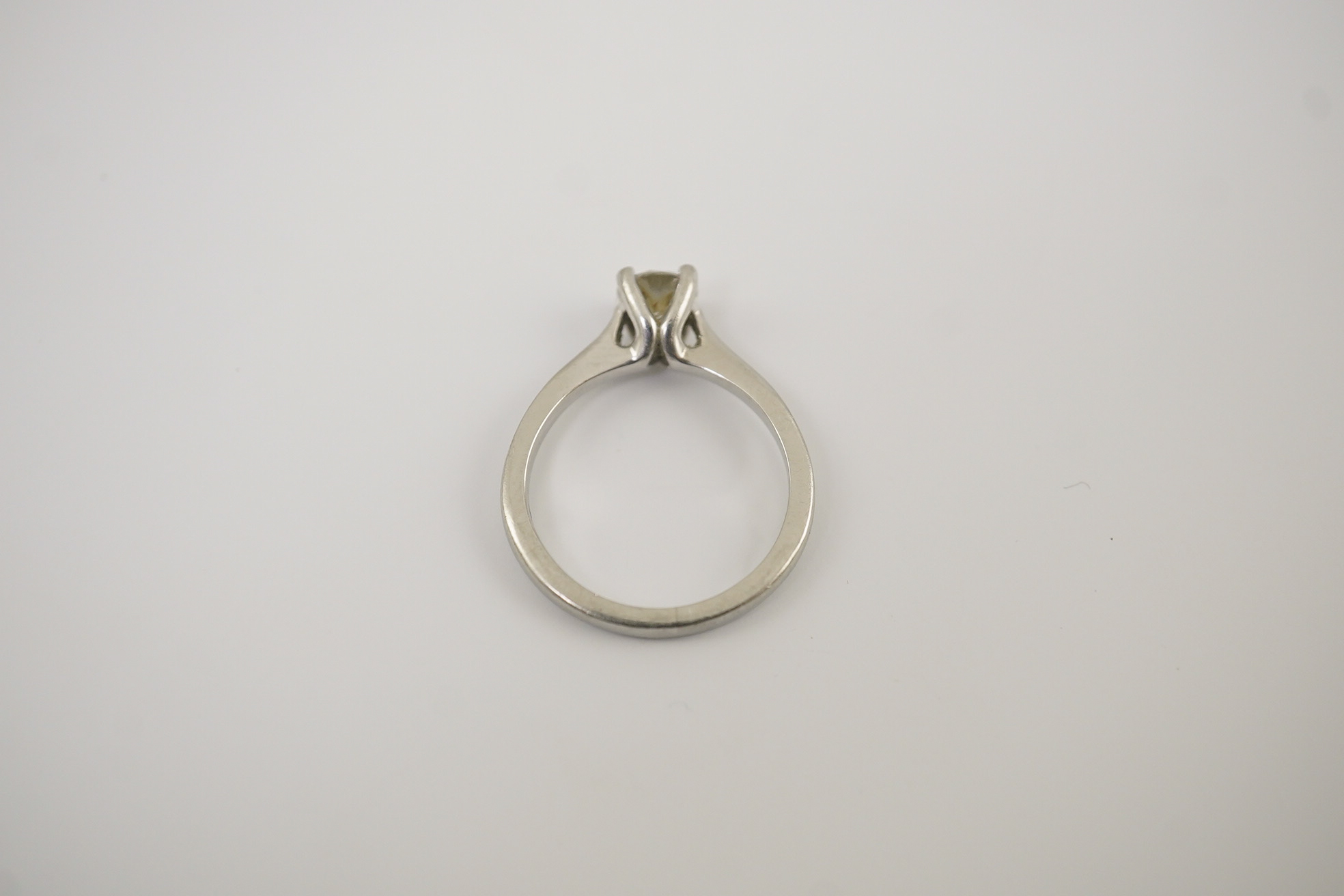 A modern platinum and solitaire diamond set ring